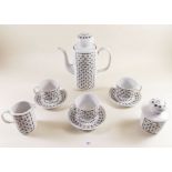 A Russian coffee set comprising: coffee pot, six cup and saucers, sugar, tea plates and milk jug