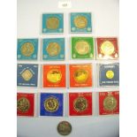 A box of 14 commemorative tokens/coins including six royal wedding Charles & Diana including