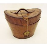 An antique leather top hatbox