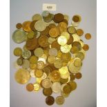 A tin of world coins including copper/bronze, nickel and some silver content - examples British,