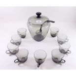 A 1960's Dartington style glass punch bowl set comprising: bowl, lid, ladle and nine glasses