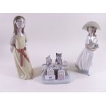 A Lladro figure of a girl in yellow dress, another Lladro figure a/f and an Lladro style animal