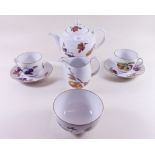 A Royal Worcester Evesham teapot, jug and sugar and six cups and saucers