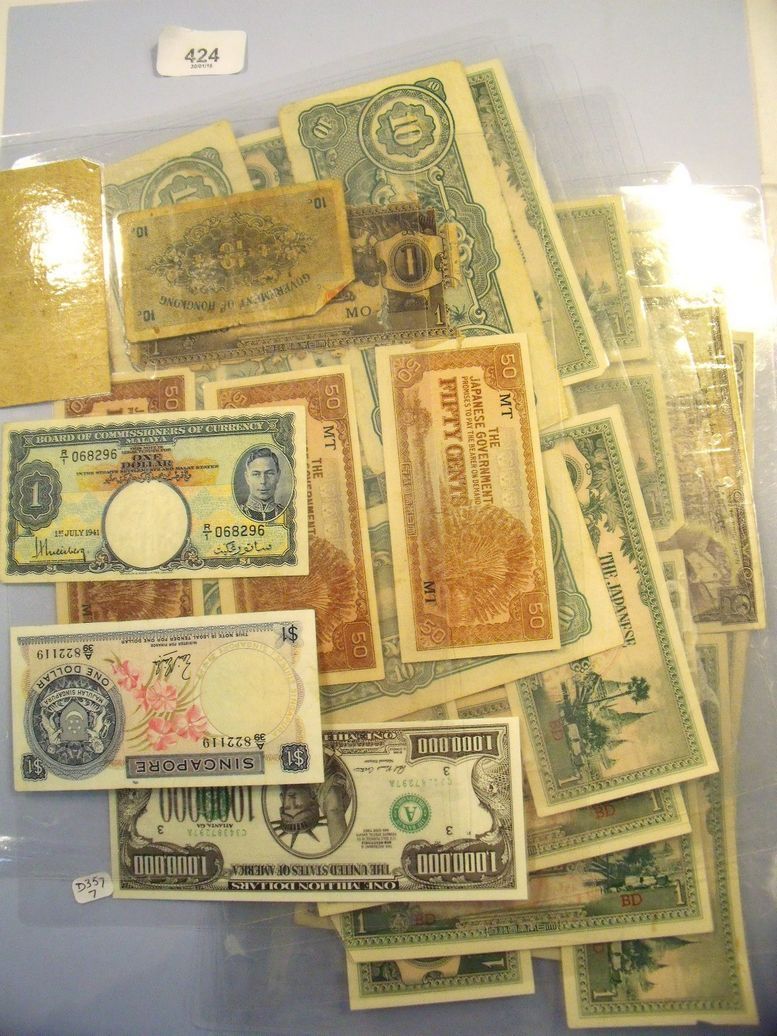 A total of eleven sheets of encapsulated world banknotes including Singapore, Malaya, Hong Kong,