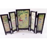 A wooden Chinese folding miniature screen inset watercolour panels