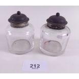A pair of silver mounted glass inkwells
