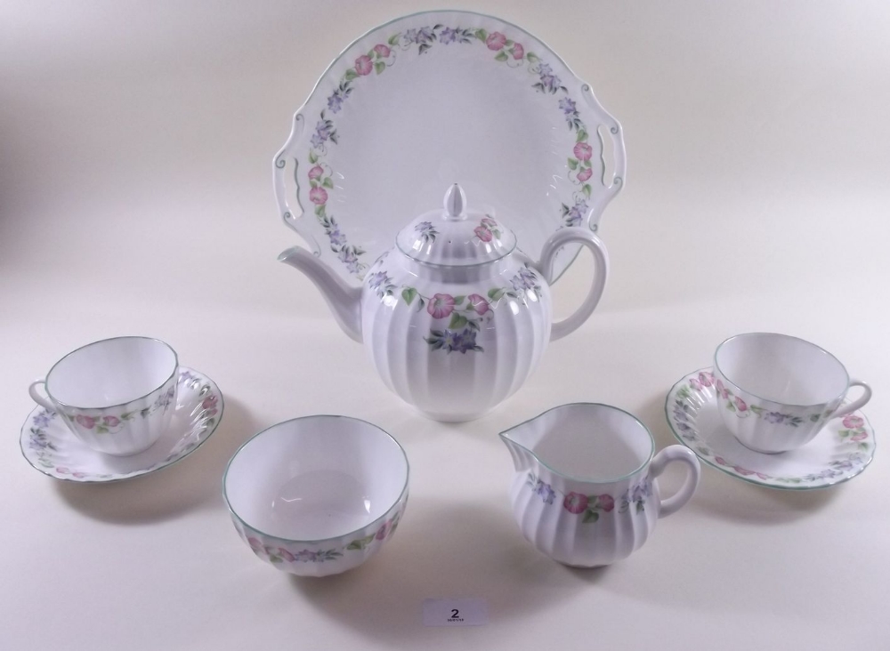 A Royal Worcester 'English Garden' tea and dinner service comprising ten dinner plates, cake