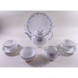 A Royal Worcester 'English Garden' tea and dinner service comprising ten dinner plates, cake