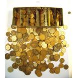 A tin of British coins including farthings, halfpennies, pennies, sixpences, shillings, halfcrowns