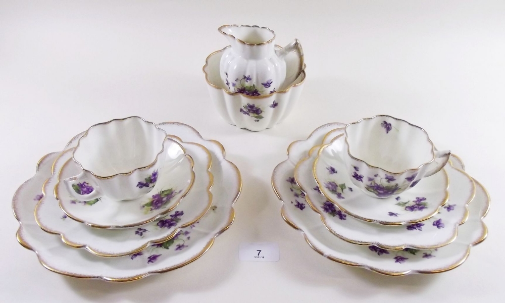 An Edwardian Melba teaset printed violets comprising: ten cups and saucers, twelve tea plates, two