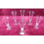 Three 19th century large and three smaller sized facet cut glass wine flutes