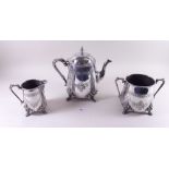 A Victorian silver plated three piece teaset with engraved and cast floral decoration