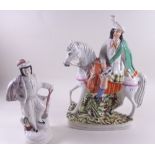 A Staffordshire figure of a standing man and a large Staffordshire figure of a man on a horse