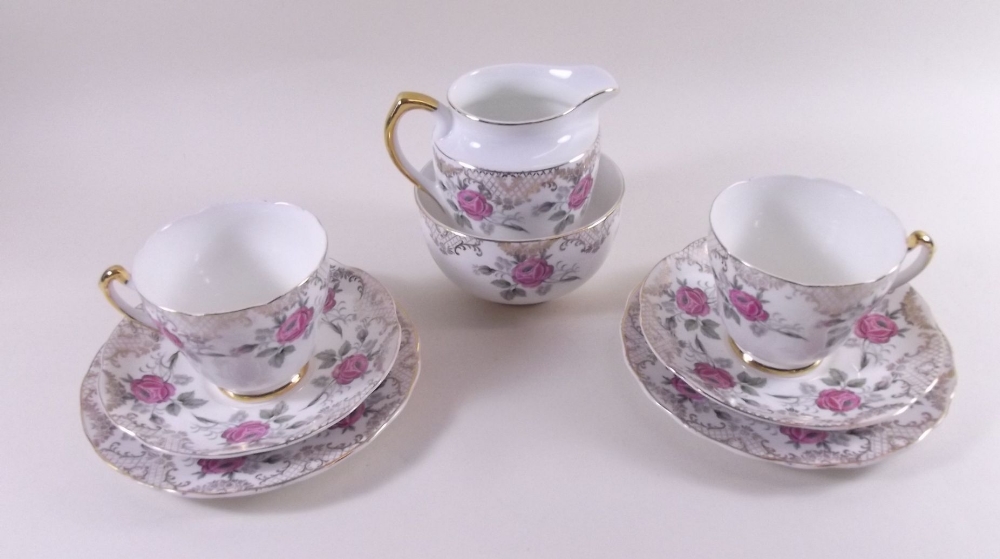 A Longport floral set of two teacups and saucers, jug and bowl