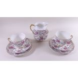 A Longport floral set of two teacups and saucers, jug and bowl