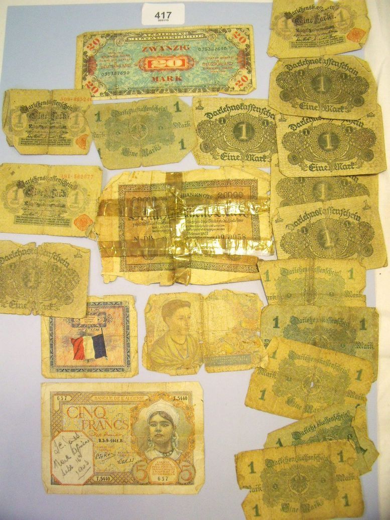 A wad of twenty world banknotes including nine German 1 mark dated 1914, six German 1 mark 1920, one
