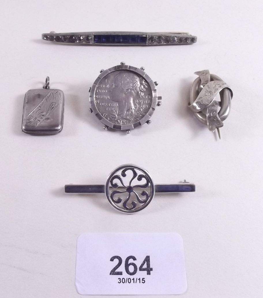 Four silver brooches and an Art Deco paste brooch