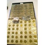 A coin album of British coins including pre-decimal halfpennies, pennies, brass threepences,