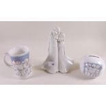 A Royal Doulton Snowman money box and mug and a Royal Worcester group - 'Friendship'