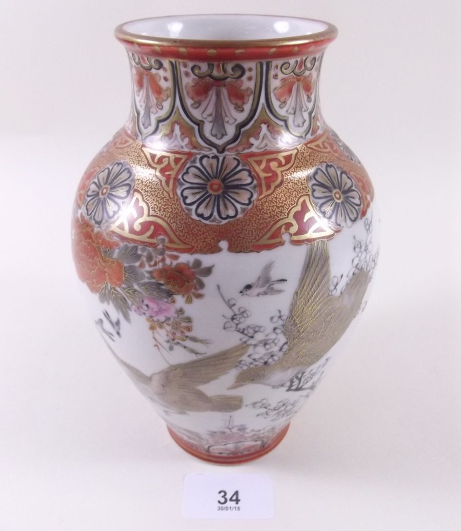 A Japanese vase decorated with doves, peonies etc, highlighted with gilding