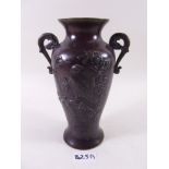 A Japanese bronze finish vase decorated birds and blossom - 21 cm high