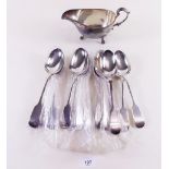 A group of silver plated tablespoons and gravy boat