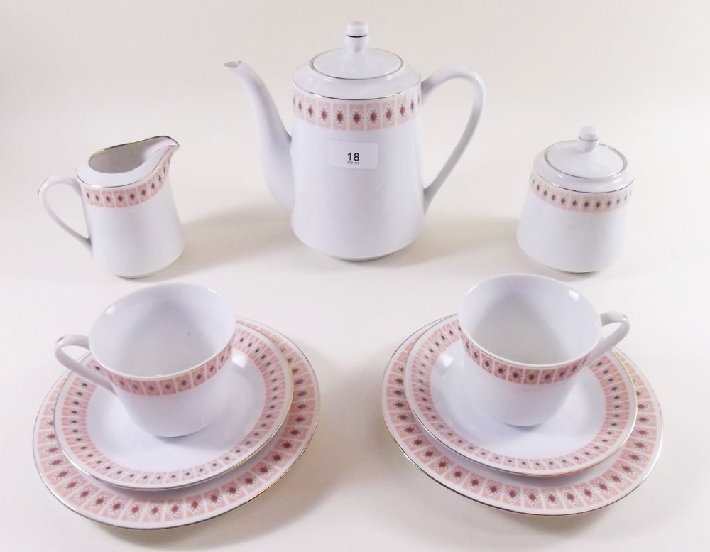 A Chinese porcelain coffee set comprising coffee pot, six cups and saucers, sugar, milk, six tea