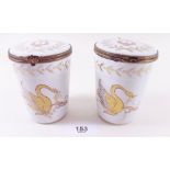 A pair of French porcelain cache pots decorated gilded swans and gilt metal mounts