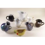 A collection of eight jugs including studio pottery