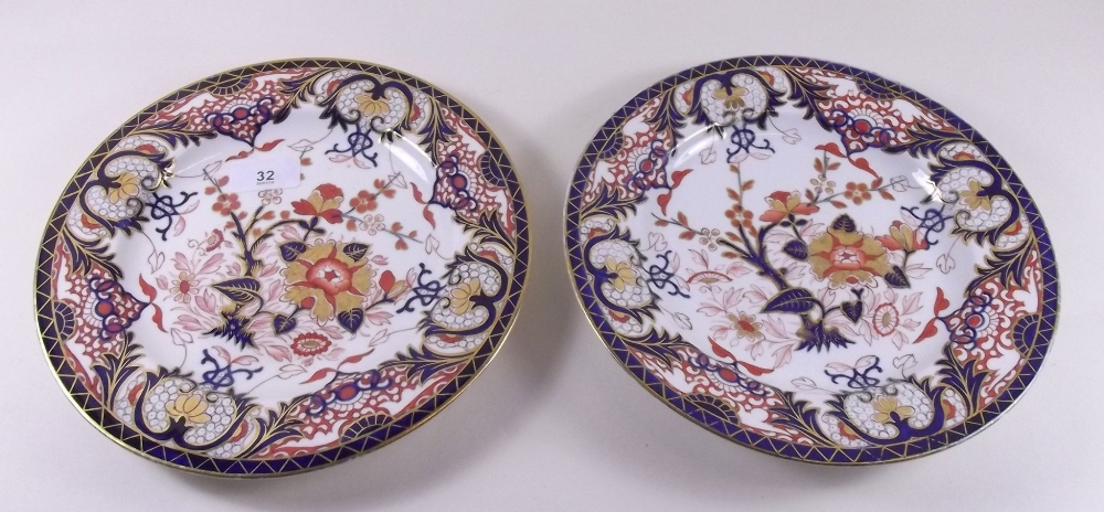 A pair of early 19th century Derby Imari plates