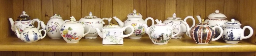 A set of twelve Victoria and Albert museum replica small teapots