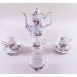 A Royal Albert 'Lavender Rose' coffee set comprising: coffee pot, jug, sugar, six cup and saucers