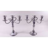 A pair of  silver plated on copper three branch candelabra