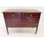 An Edwardian mahogany chest of two short and two long drawers with leather inset top