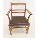 A 1930's  oak elbow chair