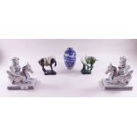 A pair of green glazed Chinese style horses, a pair of dragon candlesticks and a vase