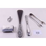 A silver pair of sugar tongs, matchbox cover, shoe horn, tweezers and sports medal