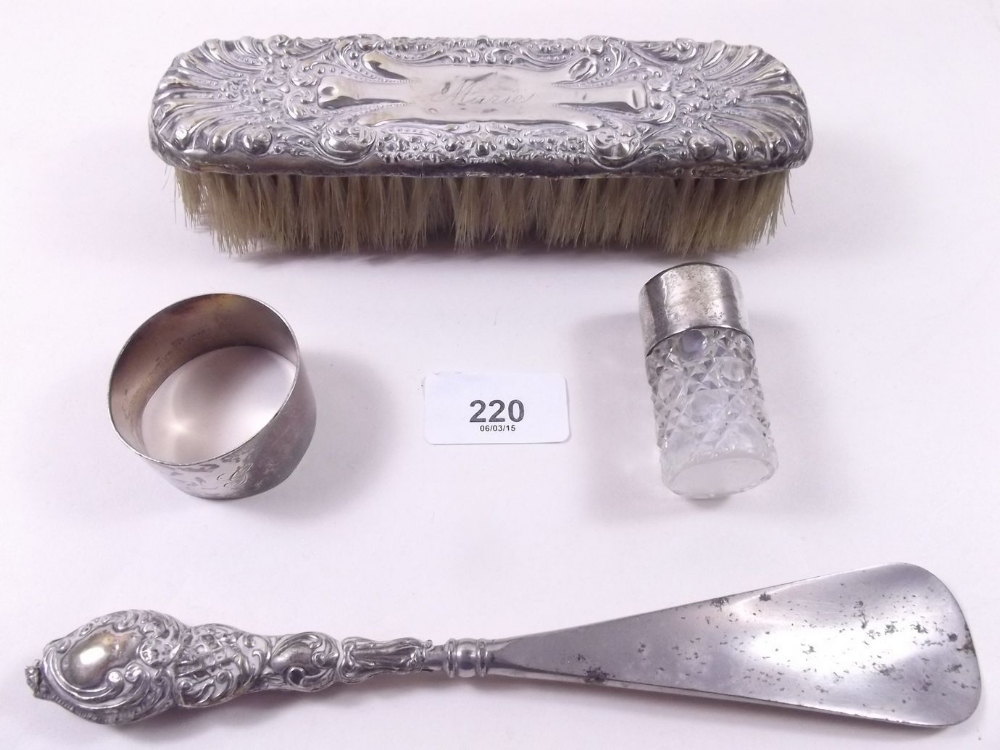 A silver backed brush, shoe horn, napkin ring and scent bottle a/f