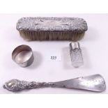 A silver backed brush, shoe horn, napkin ring and scent bottle a/f