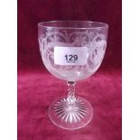 A mid Victorian large goblet engraved flowers on star cut foot