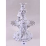 A Meissen style white centre piece base with cherubs and shells to stem, crossed swords and star