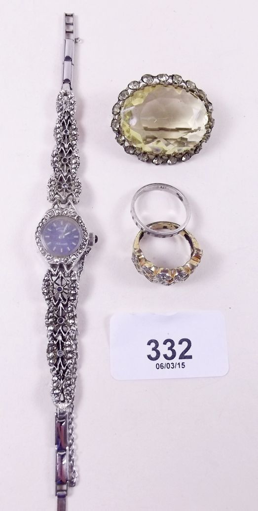 A cocktail watch, two rings and a brooch