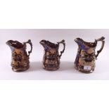 A set of three Victorian Staffordshire lustre jugs