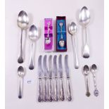 A quantity of silver spoons and five tea knives to include Georgian tablespoon (8.4 ozs excluding