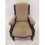 A pair of matching Victorian grandfather and grandmother chairs with spindle arm supports