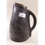A Doulton Leather Ware jug with silver mounts