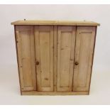 A pine wall cabinet with two pairs of doors enclosing spice rack to one side - 41"w x 41" tall x 12"