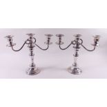 A pair of silver plated on copper candelabras