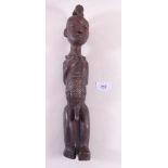 A carved wooden African native figure - 36cm