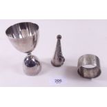 A silver napkin ring, silver plated egg cup and a snuffer from a chamberstick